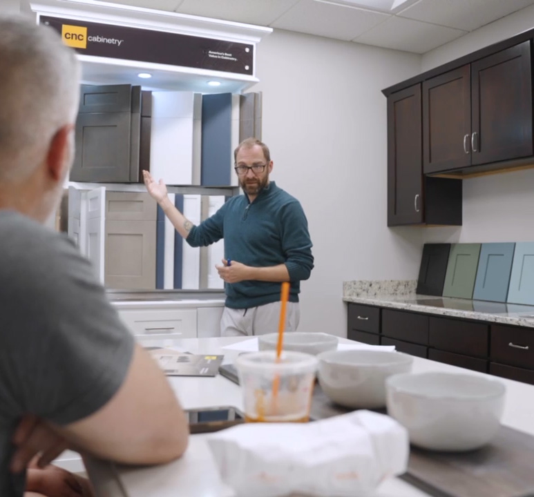 Sales person showing cabinet door styles